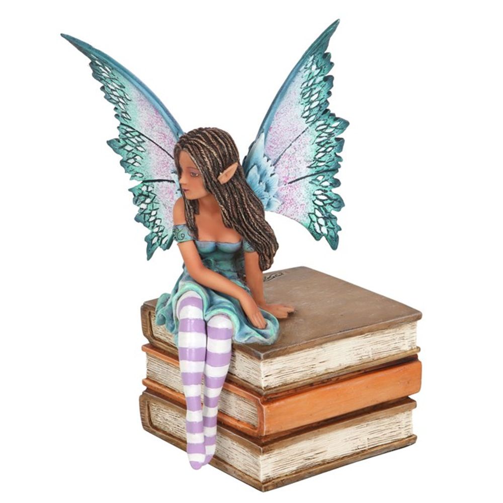 Book Fairy Figurine by Amy Brown. Based on the ‘Book Fairy’ series of watercolour paintings by fantasy artist Amy Brown, this high-quality collectible fairy figurine features painted accents that perfectly capture every magical detail of the original artwork. Intricately sculpted and cast in resin, this purple and teal fairy sits sweetly atop a small stack of books.  This figurine is officially licensed for sale at Mrs Reed's Emporium.