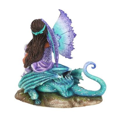 Dragon Perch Fairy Figurine by Amy Brown. Based on the ‘Dragon Perch’ watercolour painting by fantasy artist Amy Brown. This image shows the back of the figurine. You can see the detailing in the braids of her hair and the scales on her top. The base alkso has an Amy Brown signature etched into it.  Officially Licensed For Sale at Mrs Reed's Emporium & Atelier.